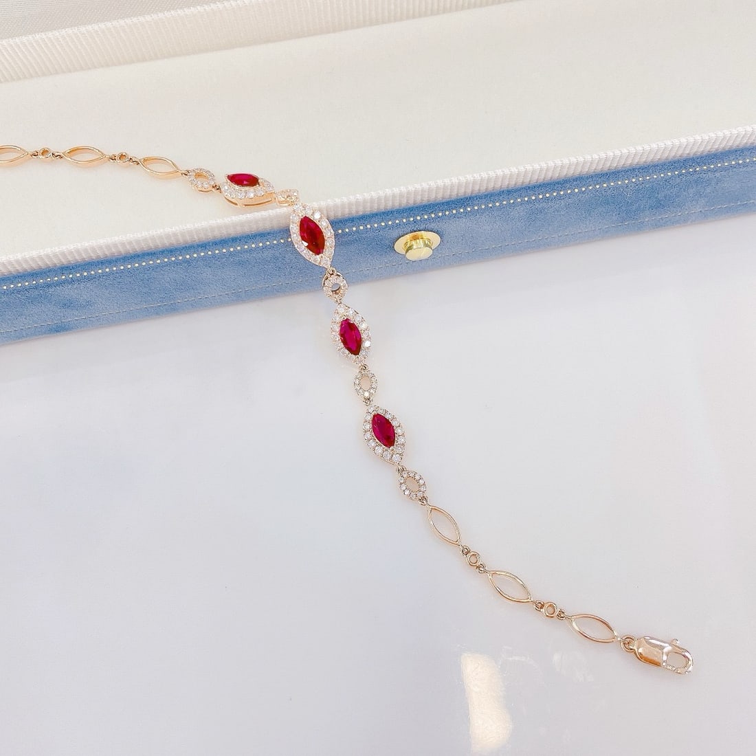 14k Gold 1.59 Ctw Vivid Red Natural Ruby & Diamond Bracelet: Ref:231192415 // gold content:14k gold // main gemstone:ruby // shape:marquise // carat weight:0. 95ct // color:vivid red // treatment:natural // // adjacent gemstone 2 : diamond // shape:round //