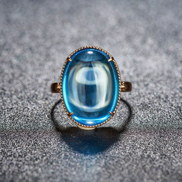 14k Gold 15.52 Ct Natural Topaz Ring: Ref:231193014 // gold content:14k gold // ring size:7. 25us // // main gemstone:topaz // shape:oval // carat weight:15. 52ct // color:blue // treatment:natural // Condition: New Low Estimate: 2600.00 