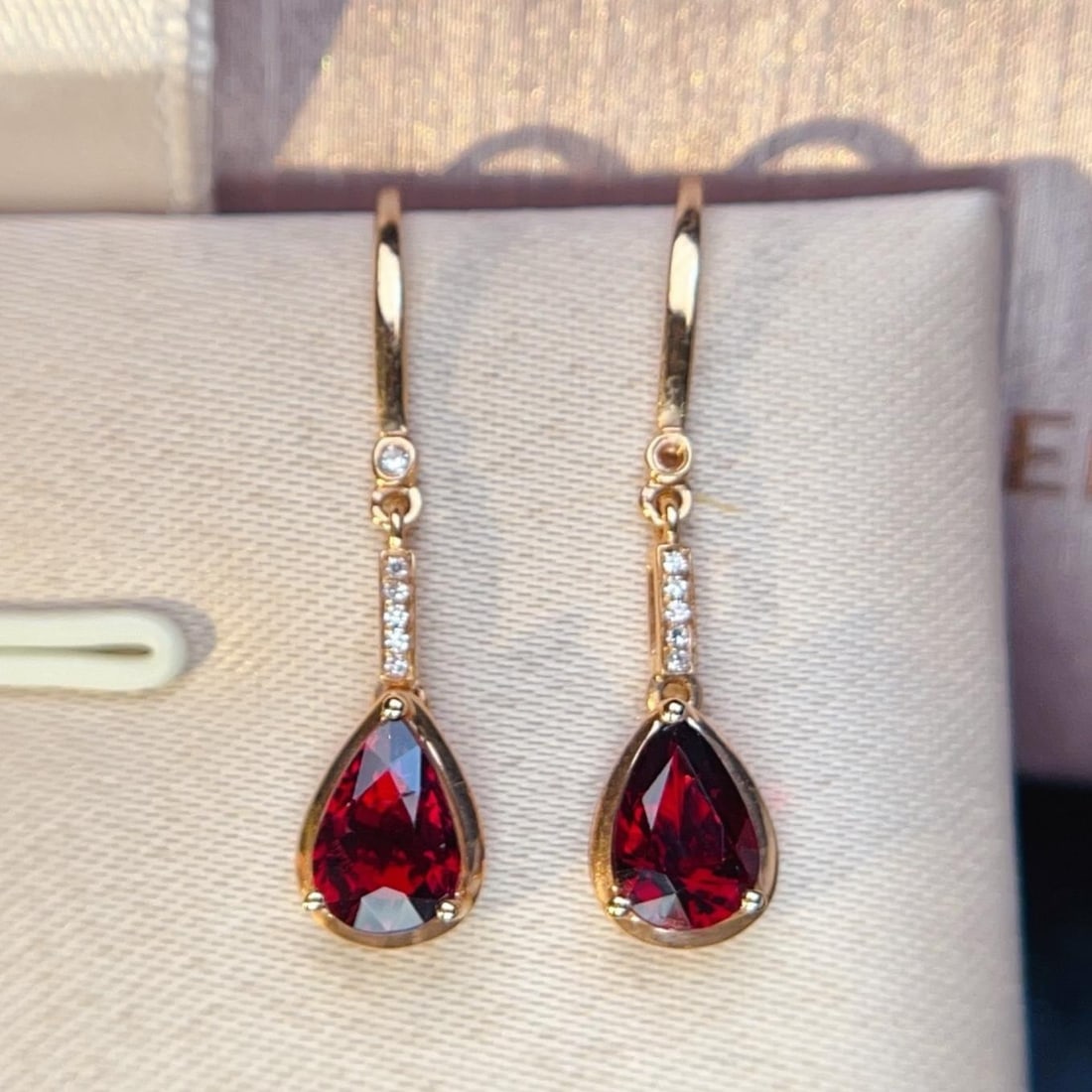 14k Gold 1.42 Ctw Natural Tourmaline & Diamond Earrings: Ref:231193152 // gold content:14k gold // main gemstone:tourmaline // shape:pear // carat weight:1. 35ct // color:red // treatment:natural // // adjacent gemstone 2 : diamond // number of stones:12 //