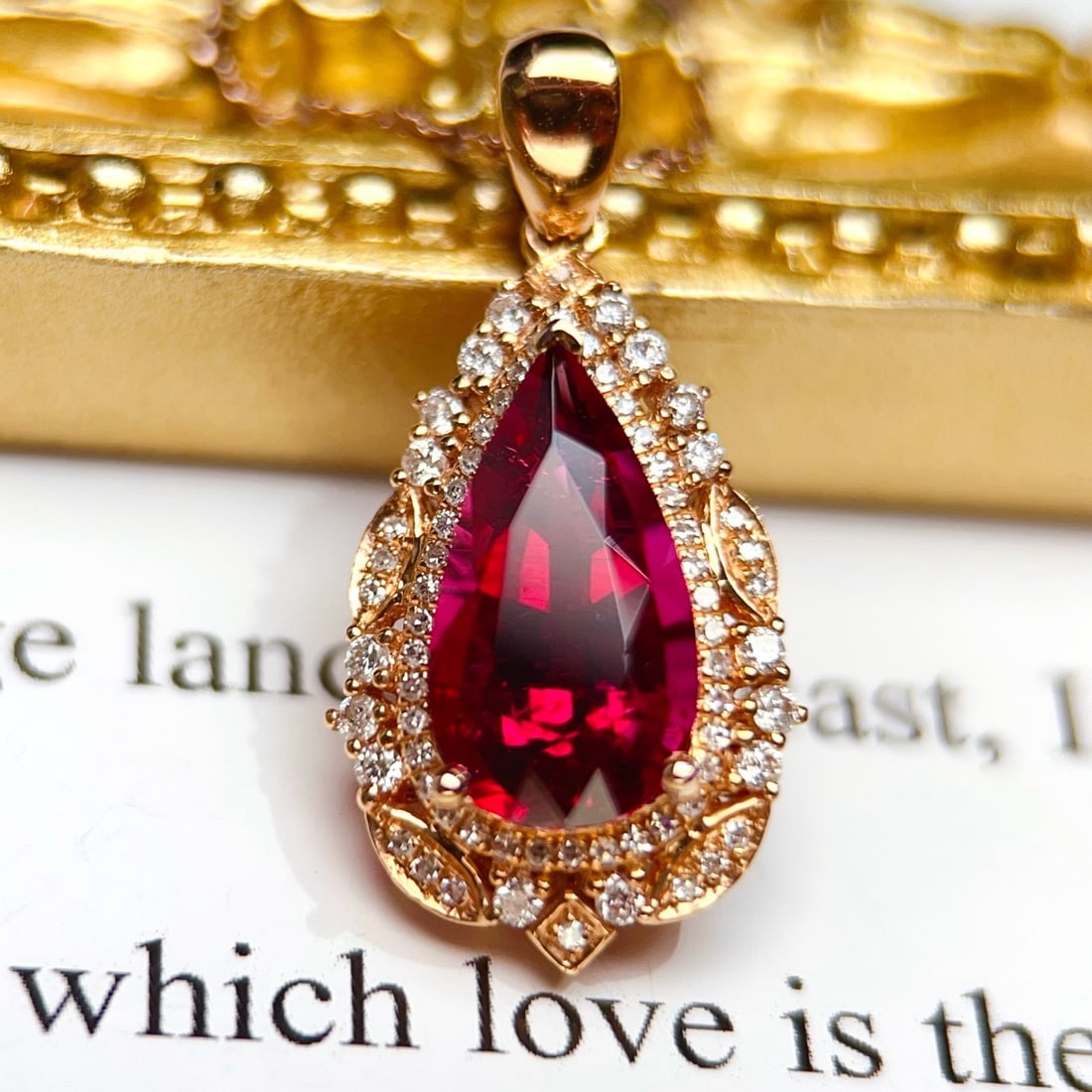 14k Gold 2.90 Ctw Natural Tourmaline & Diamond Pendant( Without Chain ): Ref:231193154 // gold content:14k gold // main gemstone:tourmaline // shape:pear // carat weight:2. 58ct // color:red // treatment:natural // // adjacent gemstone 2 : diamond // number of stones:70 //