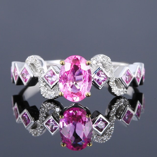 14k Gold 1.07 Ctw Natural Padparadscha Sapphire & Sapphire Ring: Ref:231194029 // gold content:14k gold // ring size:7. 25us // // main gemstone:padparadscha sapphire // shape:oval // carat weight:0. 78ct // color:orangish pink // treatment:natural // // adjacent g