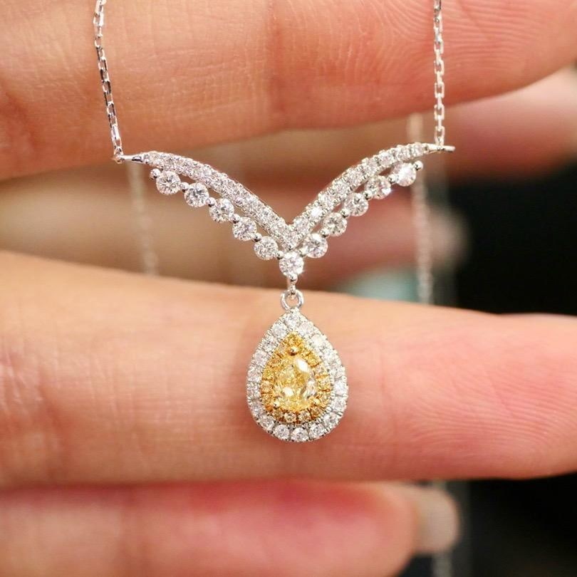 14k Gold 0.58 Ctw Natural Yellow Diamond & Diamond Necklace: Ref:231194214 // gold content:14k gold // main gemstone:yellow diamond // shape:pear // carat weight:0. 20ct // color:yellow // treatment:natural // // adjacent gemstone 2 : diamond // shape:round // 