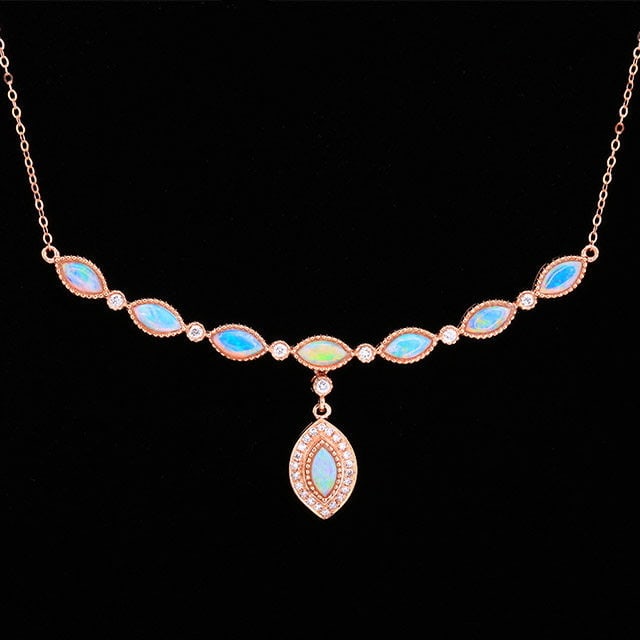 14k Gold 0.79 Ctw Natural Opal & Diamond Necklace: Ref:231194236 // gold content:14k gold // main gemstone:opal // shape:marquise // carat weight:0. 66ct // color:white // treatment:natural // // adjacent gemstone 2 : diamond // number of stones:29 //