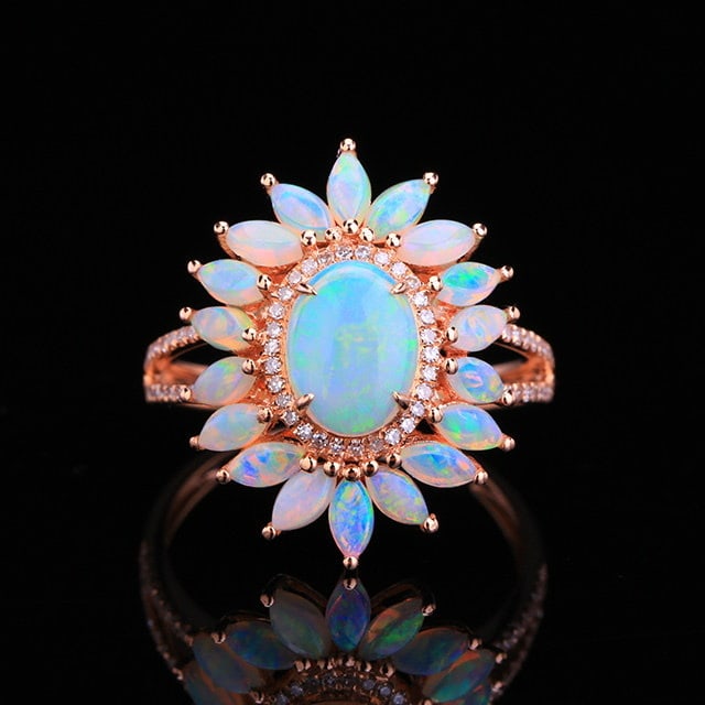 14k Gold 1.80 Ctw Natural Opal & Opal Ring: Ref:231194237 // gold content:14k gold // ring size:7. 25us // // main gemstone:opal // shape:oval // carat weight:0. 69ct // color:white // treatment:natural // // adjacent gemstone 2 : opal // shape