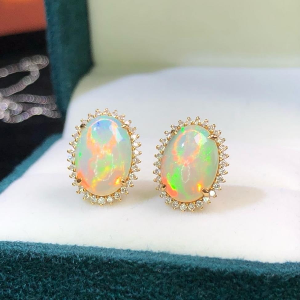 14k Gold 3.0 Ct Natural Opal & Diamond Earrings: Ref:231194307 // gold content:14k gold // main gemstone:opal // shape:oval // carat weight:3. 0ct // color:white // treatment:natural // // adjacent gemstone 2 : diamond // shape:round // clarity grad