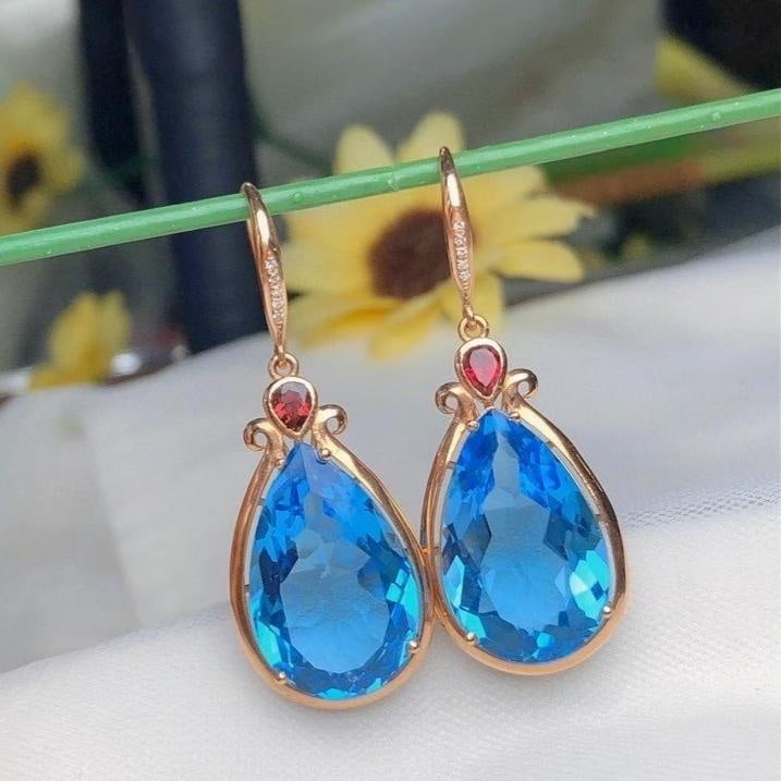 14k Gold 22.6 Ct Natural Topaz & Diamond Earrings: Ref:231194320 // gold content:14k gold // main gemstone:topaz // shape:pear // carat weight:22. 6ct // color:blue // treatment:natural // // adjacent gemstone 2 : diamond // number of stones:10 // sha