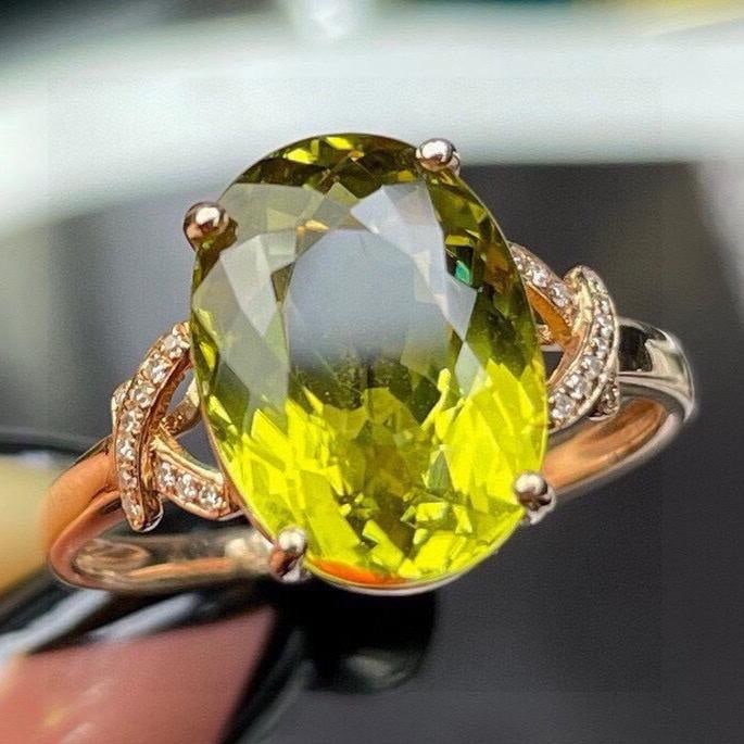 14k Gold 5.65 Ct Natural Tourmaline & Diamond Ring: Ref:231194330 // gold content:14k gold // ring size:7. 25us // // main gemstone:tourmaline // shape:oval // carat weight:5. 65ct // color:yellowish green // treatment:natural // // adjacent gemstone 2