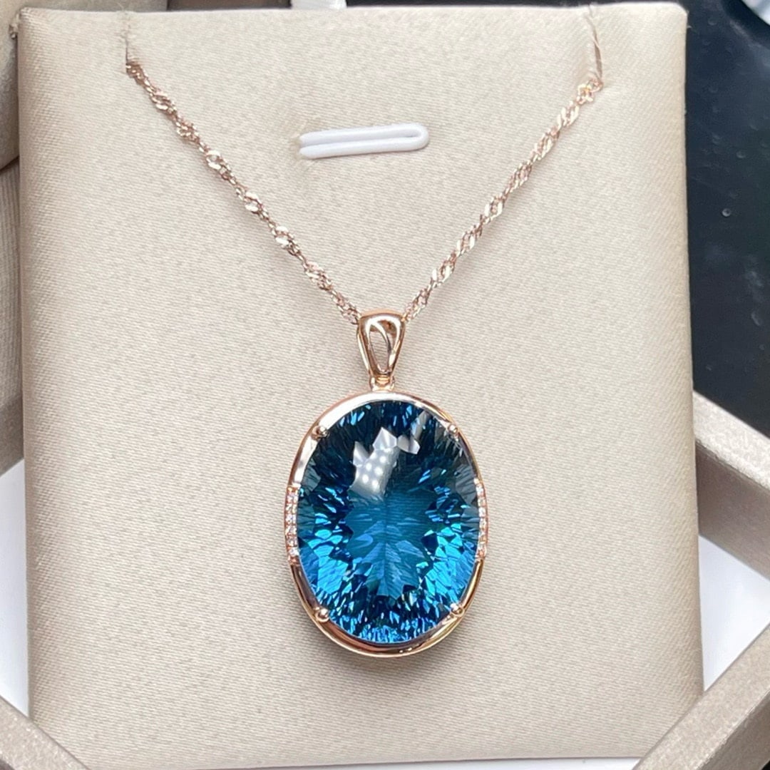 14k Gold 31.09 Ctw Natural Topaz & Diamond Pendant( Without Chain ): Ref:231194406 // gold content:14k gold // main gemstone:topaz // shape:oval // carat weight:31. 05ct // color:blue // treatment:natural // // adjacent gemstone 2 : diamond // number of stones:14 //