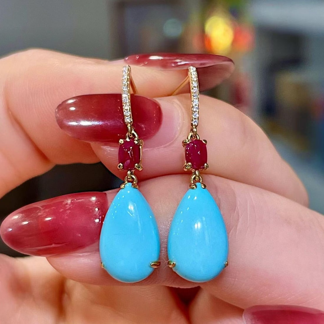 14k Gold 5.41 Ctw Natural Blue Turquoise & Ruby Earrings: Ref:231194417 // gold content:14k gold // main gemstone:blue turquoise // shape:pear // carat weight:4. 98ct // color:blue // treatment:natural // // adjacent gemstone 2 : ruby // shape:sugar-loaf //