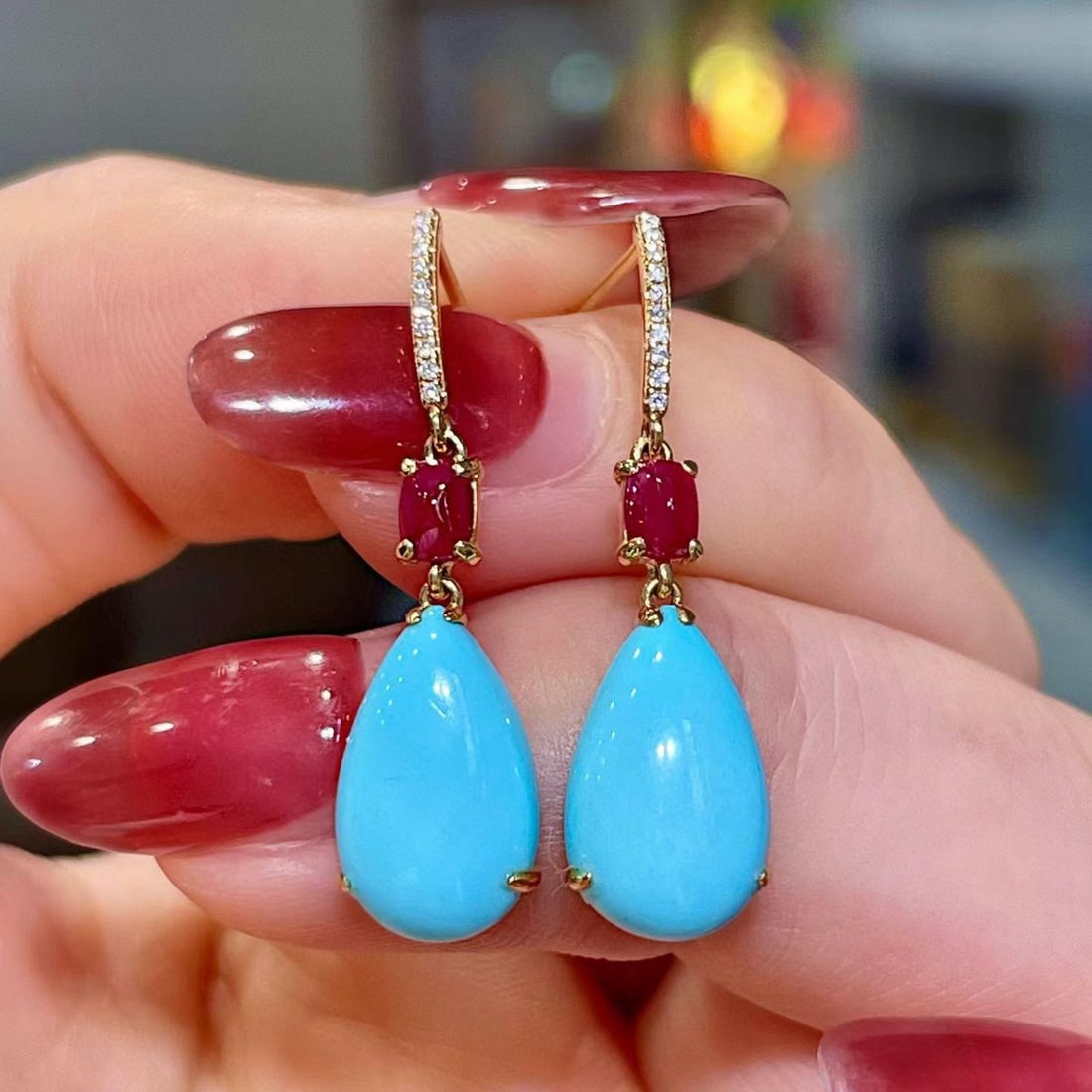 14k Gold 5.41 Ctw Natural Blue Turquoise & Ruby Earrings: Ref:231195104 // gold content:14k gold // main gemstone:blue turquoise // shape:pear // carat weight:4. 98ct // color:blue // treatment:natural // // adjacent gemstone 2 : ruby // shape:sugar-loaf // 