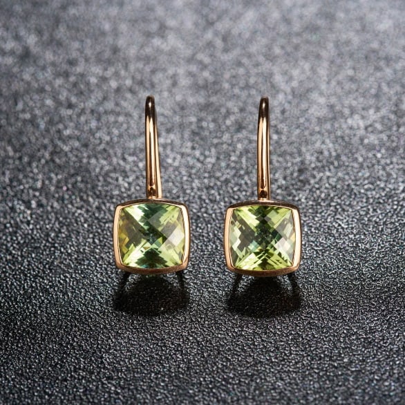 14k Gold 3.2 Ct Natural Tourmaline Earrings: Ref:231195108 // gold content:14k gold // main gemstone:tourmaline // shape:cushion // carat weight:3. 2ct // color:yellowish green // treatment:natural // Condition: New Low Estimate: 2000.00 High Es