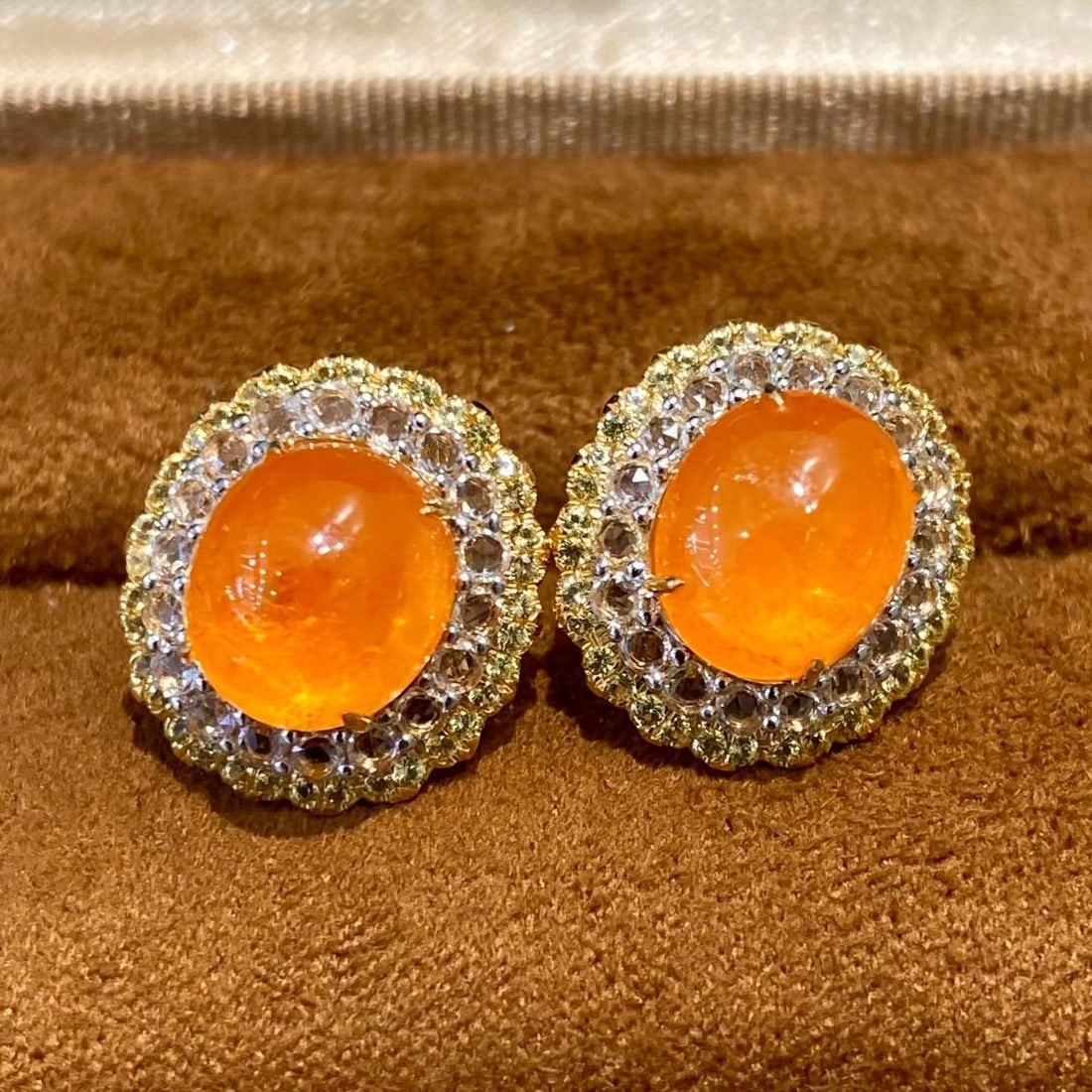 14k Gold 9.9 Ct Natural Spessartine & Sapphire Earrings: Ref:231196060 // gold content:14k gold // main gemstone:spessartine // shape:oval // carat weight:9. 9ct // color:orange // treatment:natural // // adjacent gemstone 2 : sapphire // shape:round // col