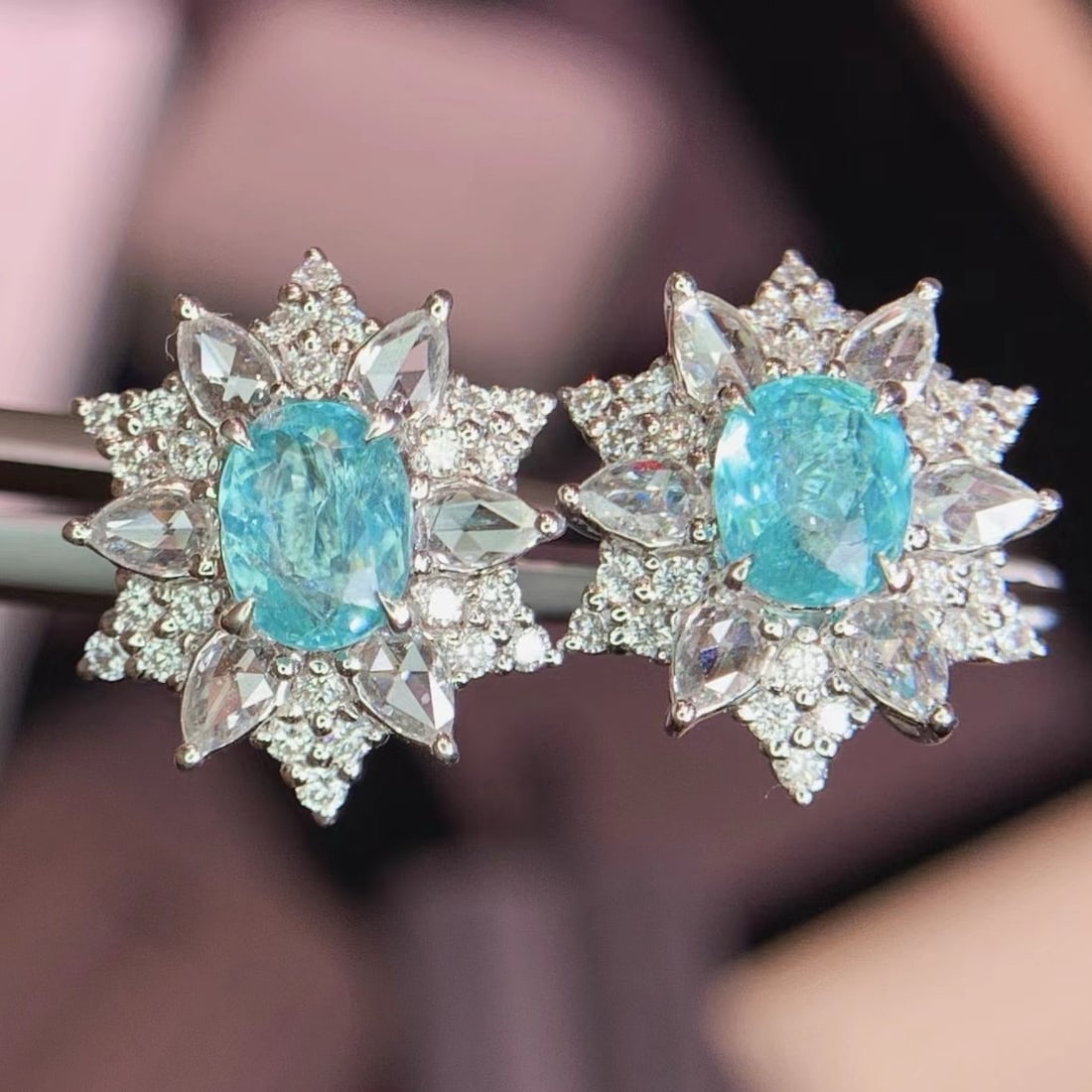 14k Gold 2.0 Ctw Natural Paraiba Tourmaline & Diamond Earrings: Ref:231196105 // gold content:14k gold // main gemstone:paraiba tourmaline // shape:oval // carat weight:1. 2ct // color:blue // treatment:natural // // adjacent gemstone 2 : diamond //