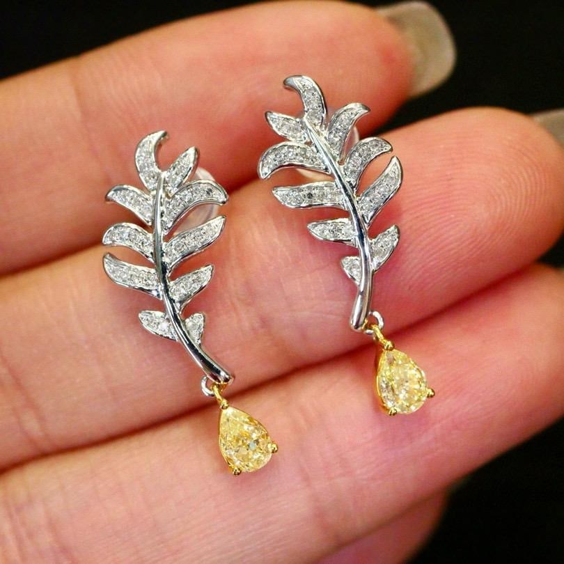14k Gold 0.63 Ctw Natural Yellow Diamond & Diamond Earrings: Ref:231196135 // gold content:14k gold // main gemstone:yellow diamond // shape:pear // carat weight:0. 51ct // color:yellow // treatment:natural // // adjacent gemstone 2 : diamond // shape:round // 