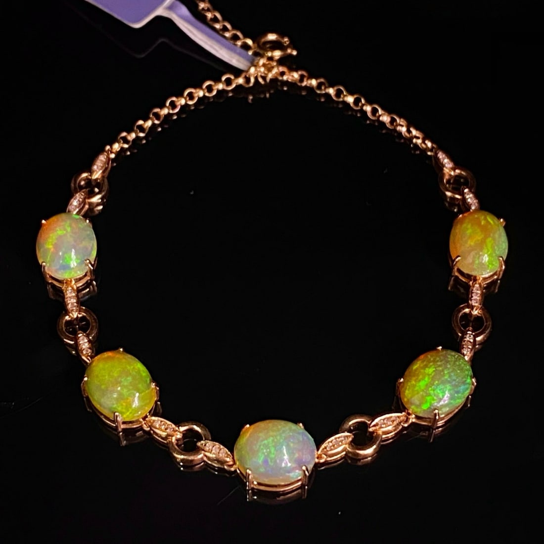 14k Gold 6.05 Ct Natural Opal & Diamond Bracelet: Ref:231173092 // gold content:14k gold // main gemstone:opal // number of stones:5 // shape:oval // carat weight:6. 05ct // color:white // treatment:natural // // adjacent gemstone 2 : diamond // numb