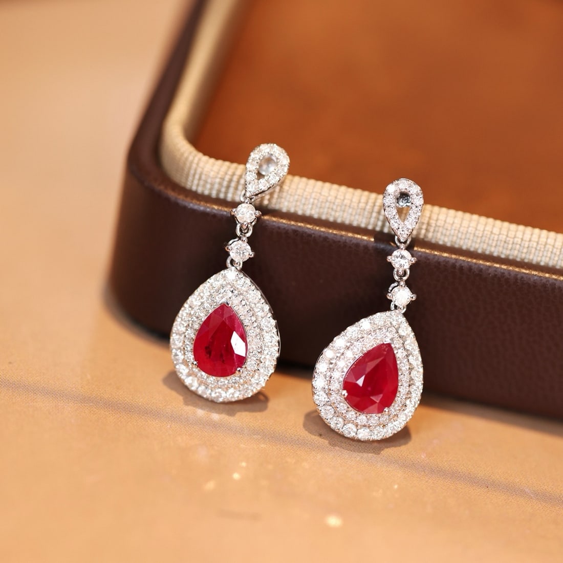 14k Gold 2.96 Ctw Vivid Red Natural Ruby & Diamond Earrings: Ref:231174086 // gold content:14k gold // main gemstone:ruby // shape:pear // carat weight:2. 07ct // color:vivid red // treatment:natural // // adjacent gemstone 2 : diamond // shape:round // carat w