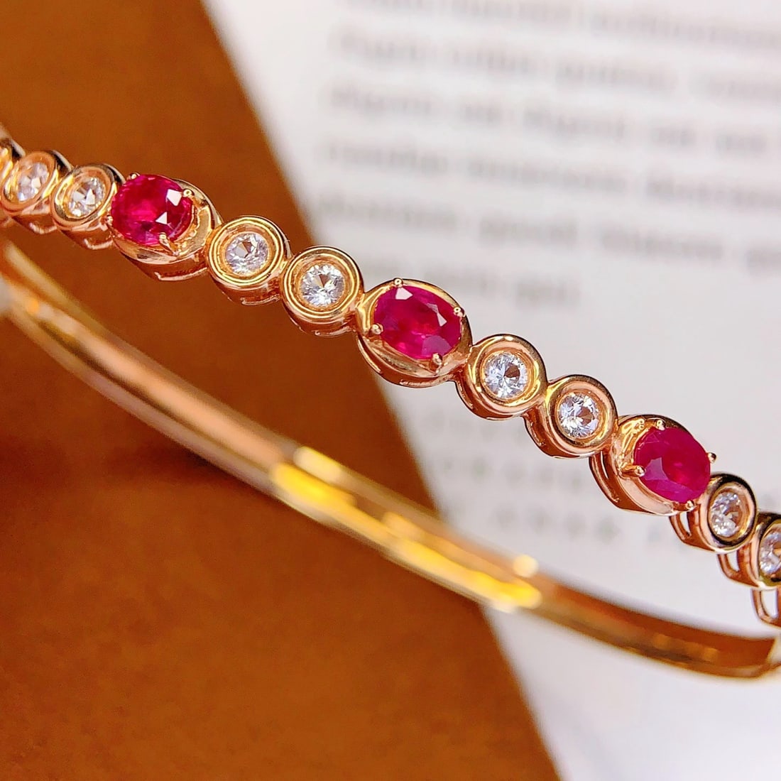 14k Gold 2 Ct Natural Ruby & Sapphire Bangle: Ref:231174277 // gold content:14k gold // main gemstone:ruby // shape:oval // carat weight:2ct // color:red // treatment:natural // // adjacent gemstone 2 : sapphire // number of stones:10 //