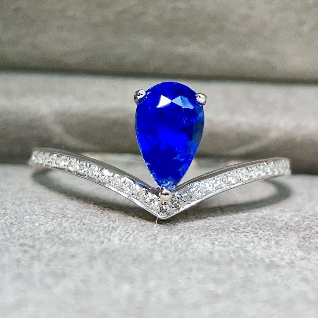 14k Gold 1.09 Ctw Natural Sapphire & Diamond Ring: Ref:231174338 // gold content:14k gold // ring size:7. 25us // // main gemstone:sapphire // shape:pear // carat weight:0. 98ct // color:blue // treatment:natural // // adjacent gemstone 2 : diamond