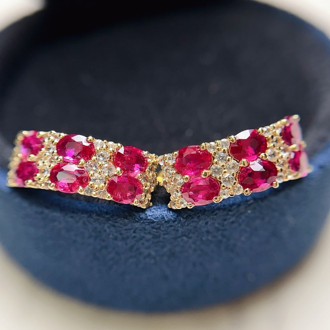 14k Gold 2.40 Ct Natural Ruby & Sapphire Earrings: Ref:231174404 // gold content:14k gold // main gemstone:ruby // shape:oval // carat weight:2. 40ct // color:red // treatment:natural // // adjacent gemstone 2 : sapphire // number of stones:32 //
