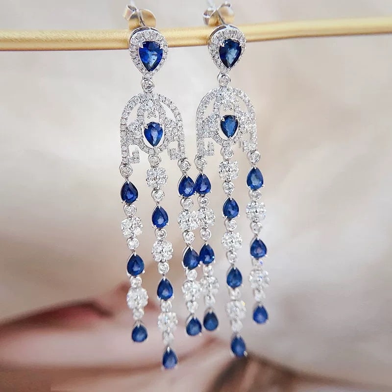 14k Gold 7.01 Ctw Natural Sapphire & Diamond Earrings: Ref:230947018 // gold content:14k gold // main gemstone:sapphire // shape:pear // carat weight:4. 78ct // color:blue // treatment:natural // // adjacent gemstone 2 : diamond // shape:round // carat