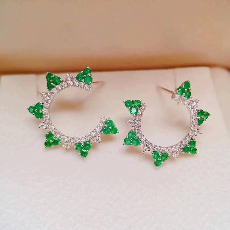 14k Gold 1.14 Ctw Natural Emerald & Diamond Earrings: Ref:230947034 // gold content:14k gold // main gemstone:emerald // shape:round // carat weight:0. 7ct // color:green // treatment:natural // cut grade:g // // adjacent gemstone 2 : diamond // shape:ro