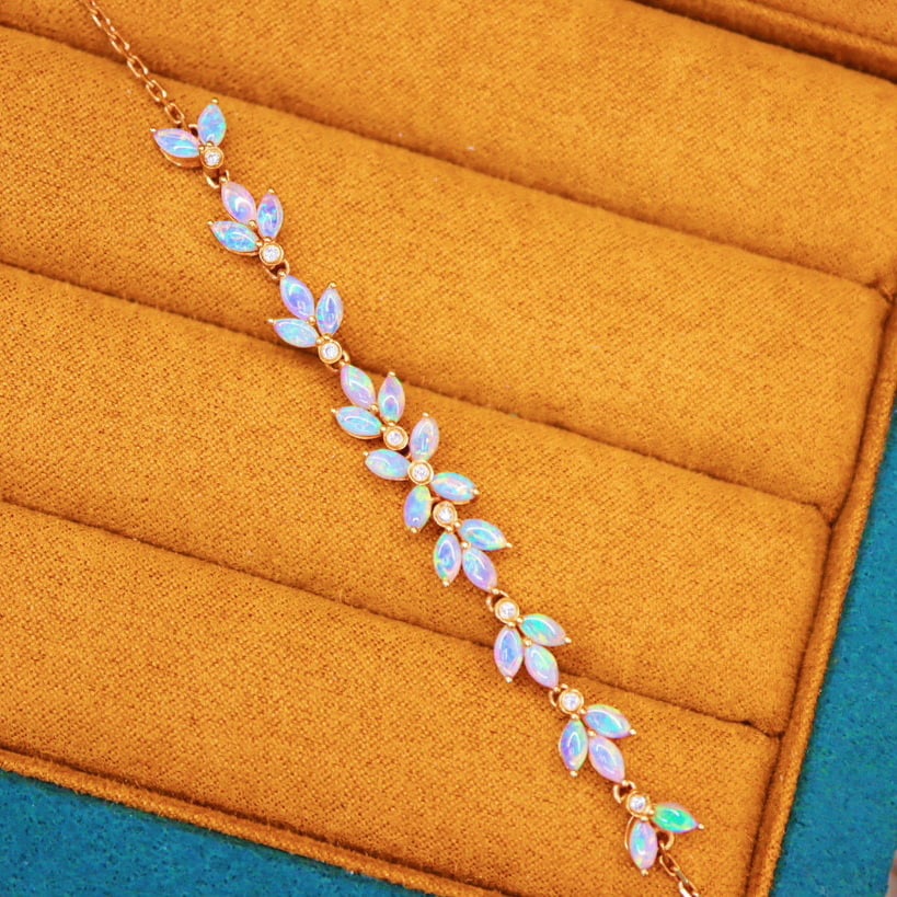 14k Gold 2.30 Ctw Natural Opal & Diamond Bracelet: Ref:230947048 // gold content:14k gold // main gemstone:opal // shape:marquise // carat weight:2. 21ct // color:white // treatment:natural // // adjacent gemstone 2 : diamond // number of stones:9