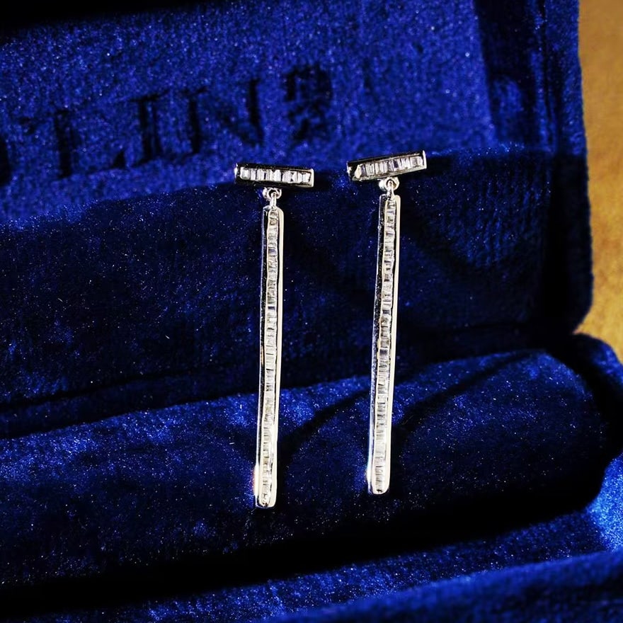 14k Gold 0.42 Ct Natural H Diamond Earrings: Ref:230947156 // gold content:14k gold // main gemstone:diamond // shape:baguette // carat weight:0. 42ct // clarity grade:vs-si // color:h // treatment:natural // Condition: NewLow Estimate: