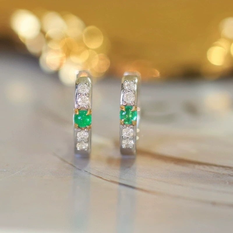 14k Gold 0.4 Ctw Natural Emerald & Diamond Earrings: Ref:230947193 // gold content:14k gold // main gemstone:emerald // shape:round // carat weight:0. 2ct // color:green // treatment:natural // cut grade:g // // adjacent gemstone 2 : diamond //