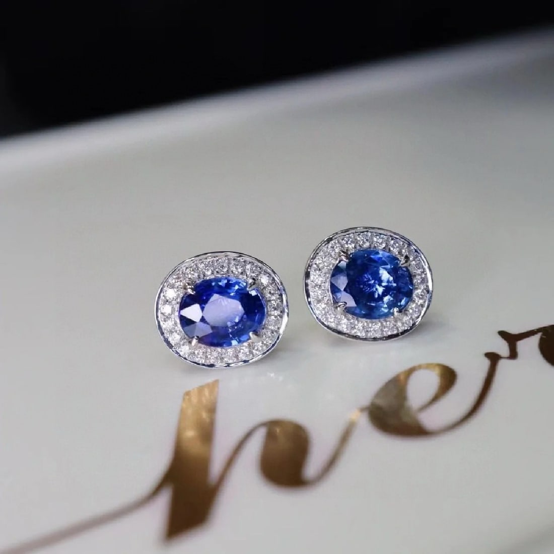 14k Gold 2 Ct Natural Sapphire & Diamond Earrings: Ref:230947238 // gold content:14k gold // main gemstone:sapphire // shape:oval // carat weight:2ct // color:blue // treatment:natural // // adjacent gemstone 2 : diamond // shape:round // clarity
