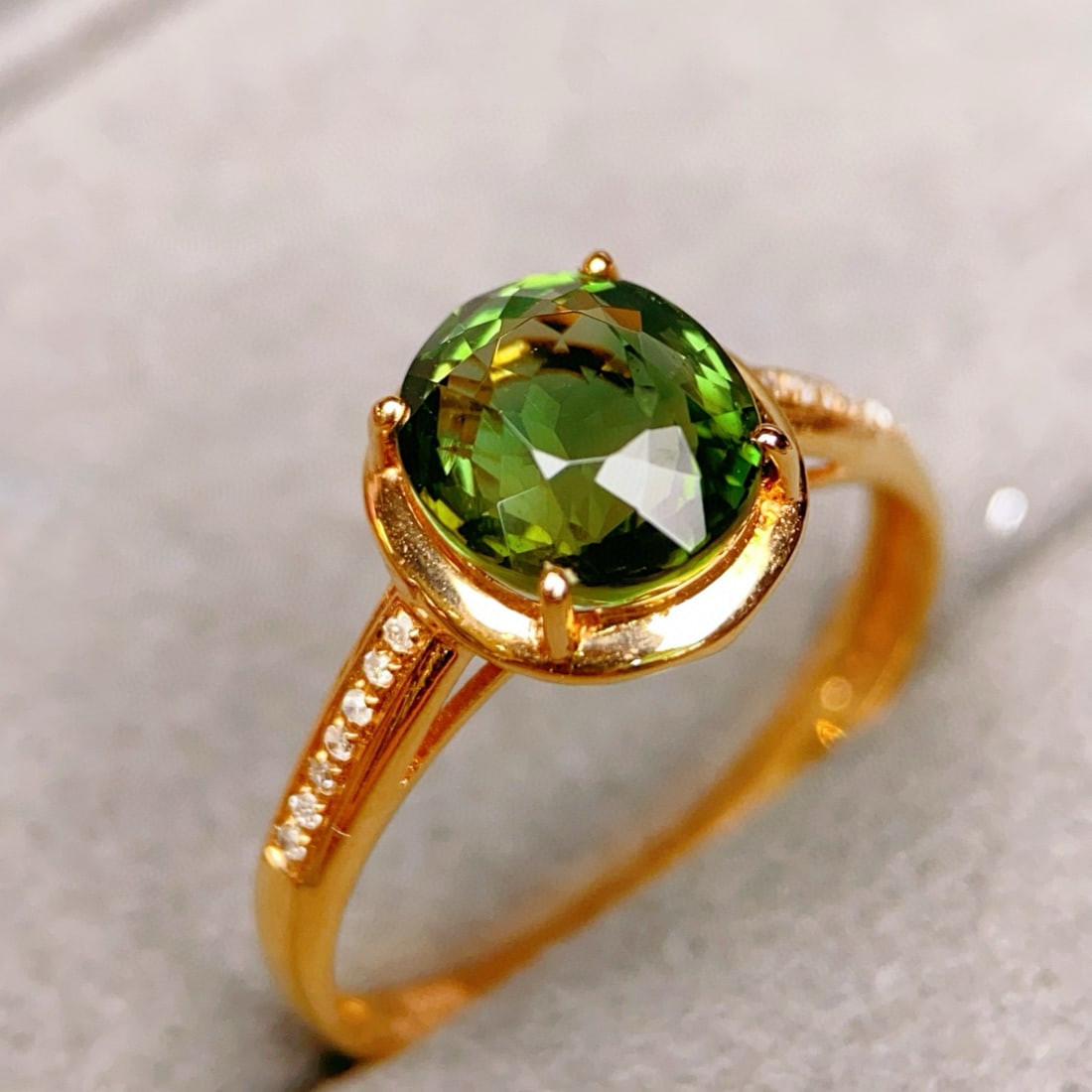14k Gold 2.24 Ctw Natural Tourmaline & Diamond Ring: Ref:230947252 // gold content:14k gold // ring size:7. 25us // // main gemstone:tourmaline // shape:oval // carat weight:2. 2ct // color:green // treatment:natural // // adjacent gemstone 2 : diamond