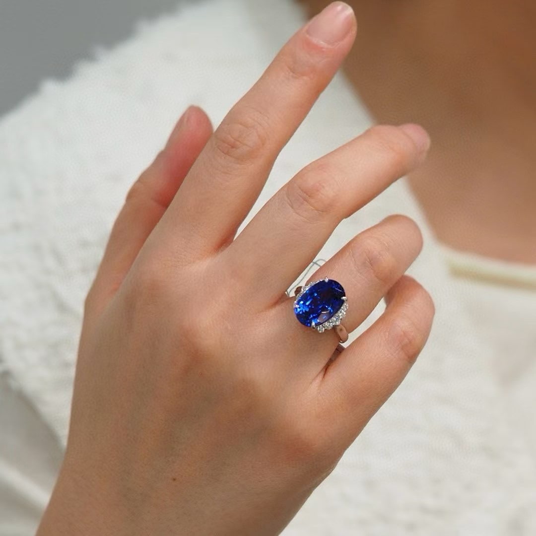 14k Gold 8.77 Ctw Natural Tanzanite & Diamond Ring: Ref:230948010 // gold content:14k gold // ring size:7. 25us // // main gemstone:tanzanite // shape:oval // carat weight:8. 40ct // color:blue // treatment:natural // // adjacent gemstone 2 :