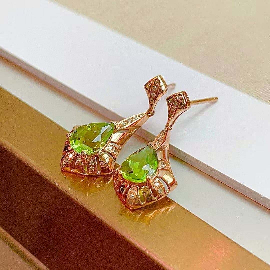 14k Gold 1.59 Ct Natural Tourmaline & Diamond Earrings: Ref:230948161 // gold content:14k gold // main gemstone:tourmaline // shape:pear // carat weight:1. 59ct // color:green // treatment:natural // // adjacent gemstone 2 : diamond // shape:round // clari
