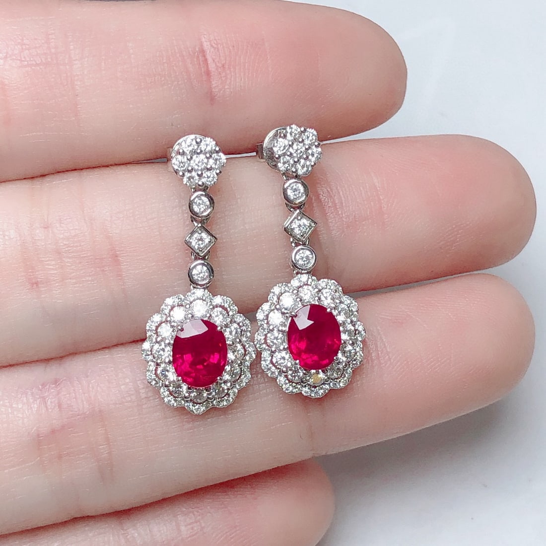 14k Gold 2.44 Ctw Natural Ruby & Diamond Earrings: Ref:230948206 // gold content:14k gold // main gemstone:ruby // shape:oval // carat weight:1. 52ct // color:red // treatment:natural // // adjacent gemstone 2 : diamond // shape:round // carat weight: