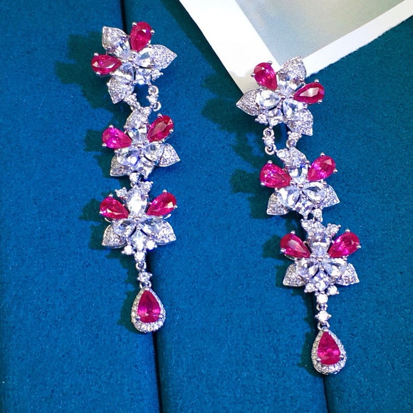 14k Gold 7.05 Ctw Natural Ruby & Sapphire Earrings: Ref:230948220 // gold content:14k gold // main gemstone:ruby // shape:pear // carat weight:3. 55ct // color:red // treatment:natural // // adjacent gemstone 2 : sapphire // shape:pear // carat