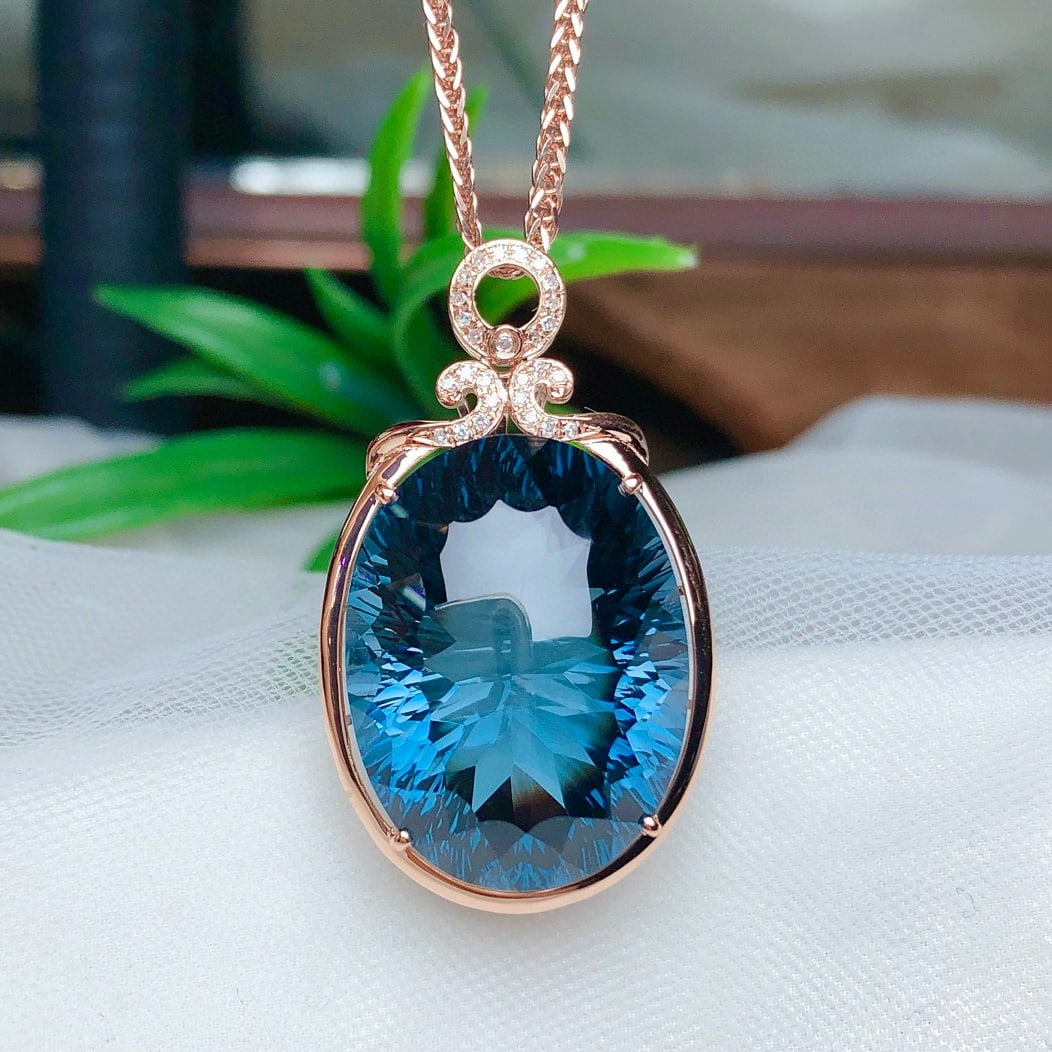 14k Gold 34.05 Ct Natural Topaz & Diamond Pendant( Without Chain ): Ref:230948405 // gold content:14k gold // main gemstone:topaz // shape:oval // carat weight:34. 05ct // color:blue // treatment:natural // // adjacent gemstone 2 : diamond // number of stones:27 //