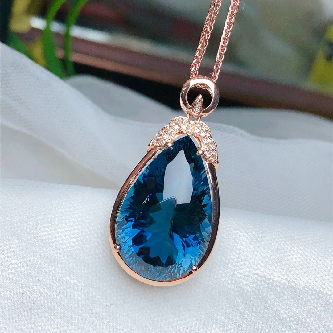 14k Gold 21.65 Ct Natural Topaz & Diamond Pendant( Without Chain ): Ref:230948446 // gold content:14k gold // main gemstone:topaz // shape:pear // carat weight:21. 65ct // color:blue // treatment:natural // // adjacent gemstone 2 : diamond // number of stones:28 // sh