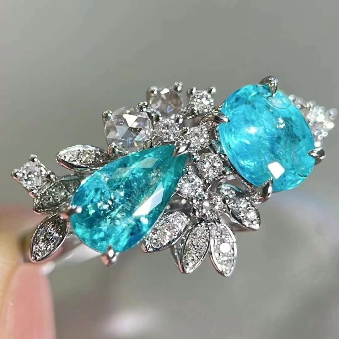 14k Gold 2.2 Ctw Natural Paraiba Tourmaline & Diamond Ring: Ref:230949099 // gold content:14k gold // ring size:7. 25us // // main gemstone:paraiba tourmaline // shape:multiply // carat weight:1. 8ct // color:neon blue // treatment:natural // // adjacent gemst