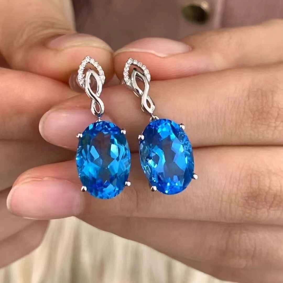 14k Gold 12.62 Ctw Natural Topaz & Diamond Earrings: Ref:230949260 // gold content:14k gold // main gemstone:topaz // shape:oval // carat weight:12. 56ct // color:blue // treatment:natural // // adjacent gemstone 2 : diamond // number of stones:22 // sh
