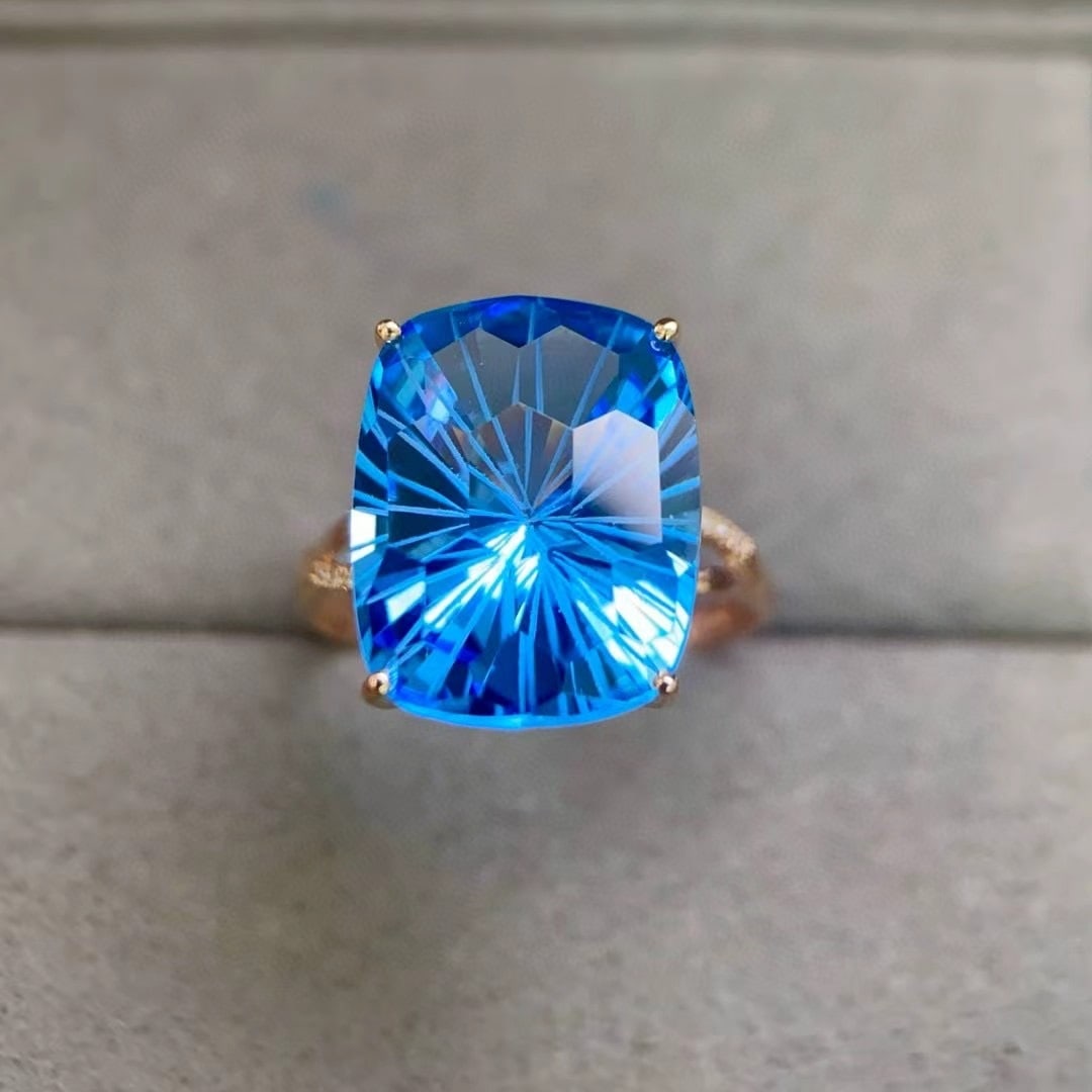 14k Gold 11.88 Ctw Natural Topaz & Diamond Ring: Ref:230950070 // gold content:14k gold // ring size:7. 25us // // main gemstone:topaz // shape:cushion // carat weight:11. 85ct // color:blue // treatment:natural // // adjacent gemstone 2 : diamond /