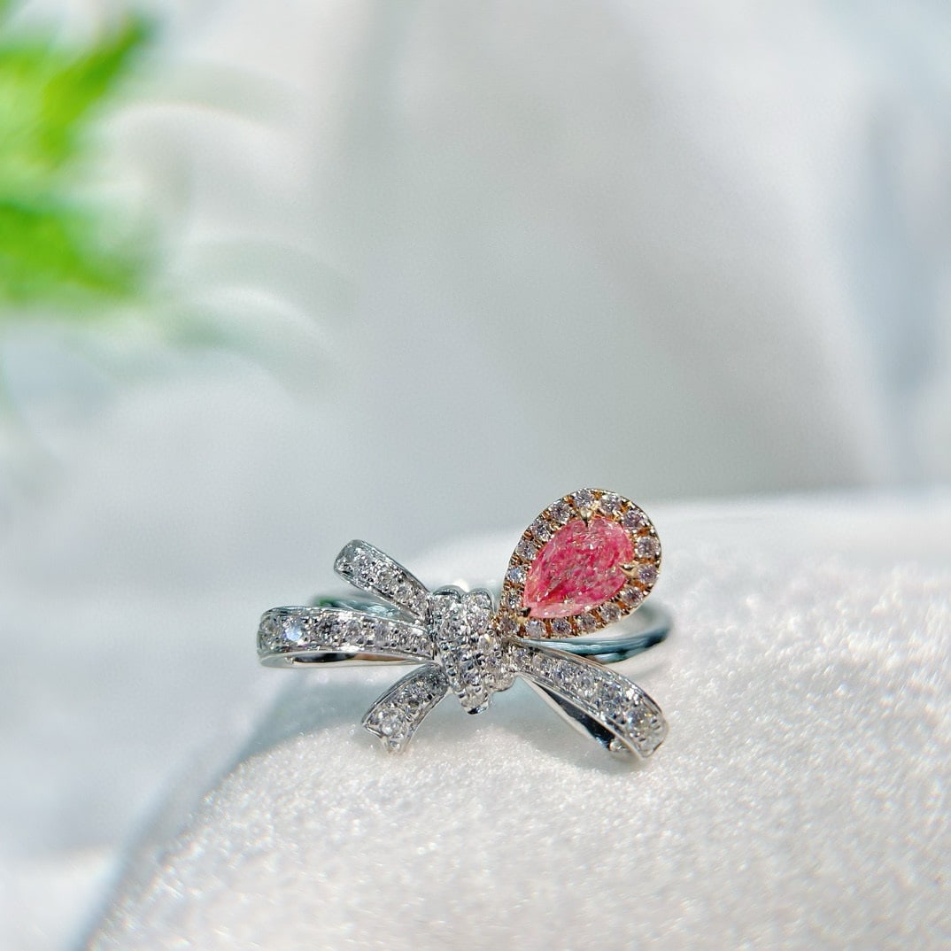 14k Gold 0.60 Ctw Natural Pink Diamond & Diamond Ring: Ref:230950163 // gold content:14k gold // ring size:7. 25us // // main gemstone:pink diamond // shape:pear // carat weight:0. 35ct // color:pink // treatment:natural // // adjacent gemstone 2 :