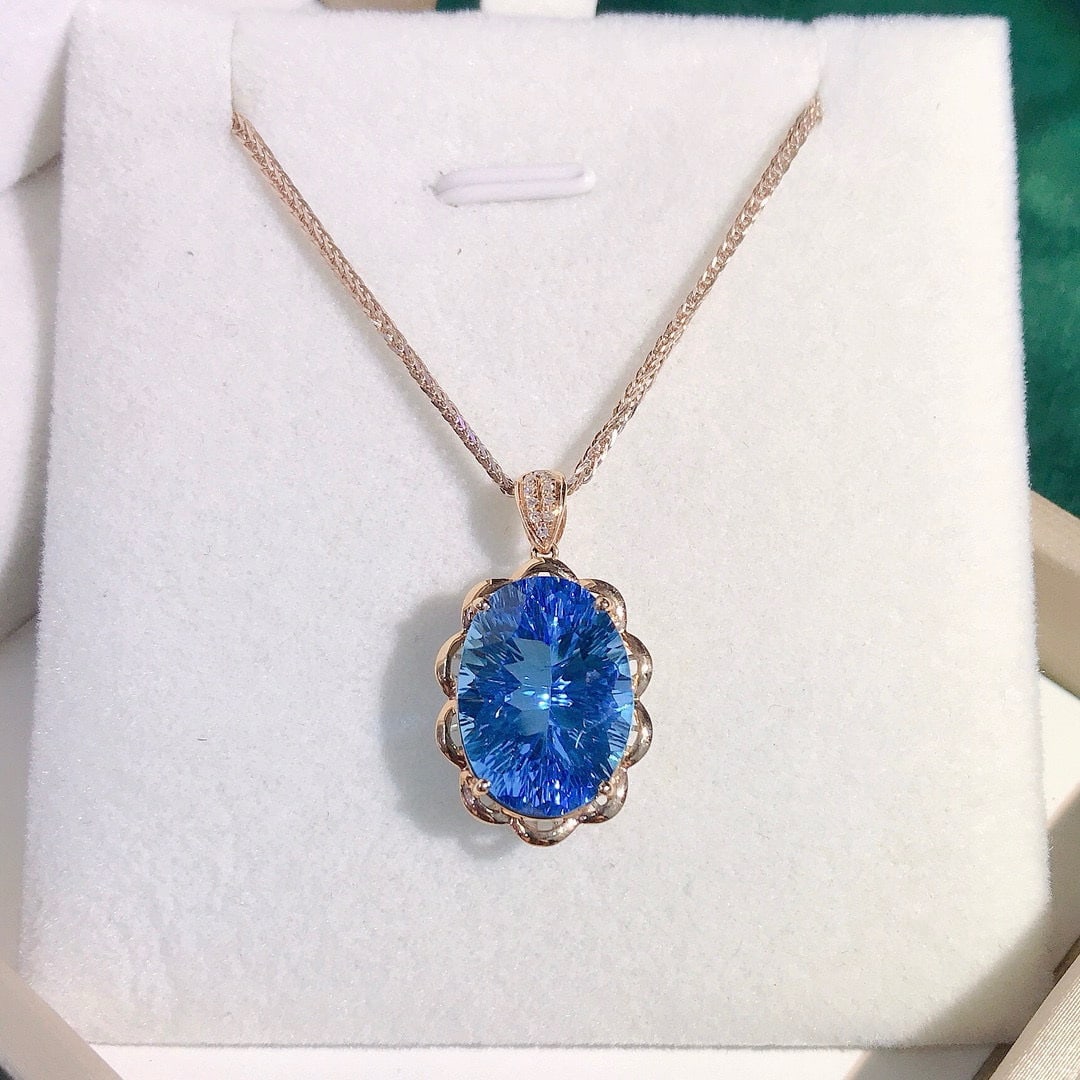 14k Gold 8.68 Ctw Natural Topaz & Diamond Pendant( Without Chain ): Ref:230950279 // gold content:14k gold // main gemstone:topaz // shape:oval // carat weight:8. 65ct // color:blue // treatment:natural // // adjacent gemstone 2 : diamond // number of stones:10 // sha