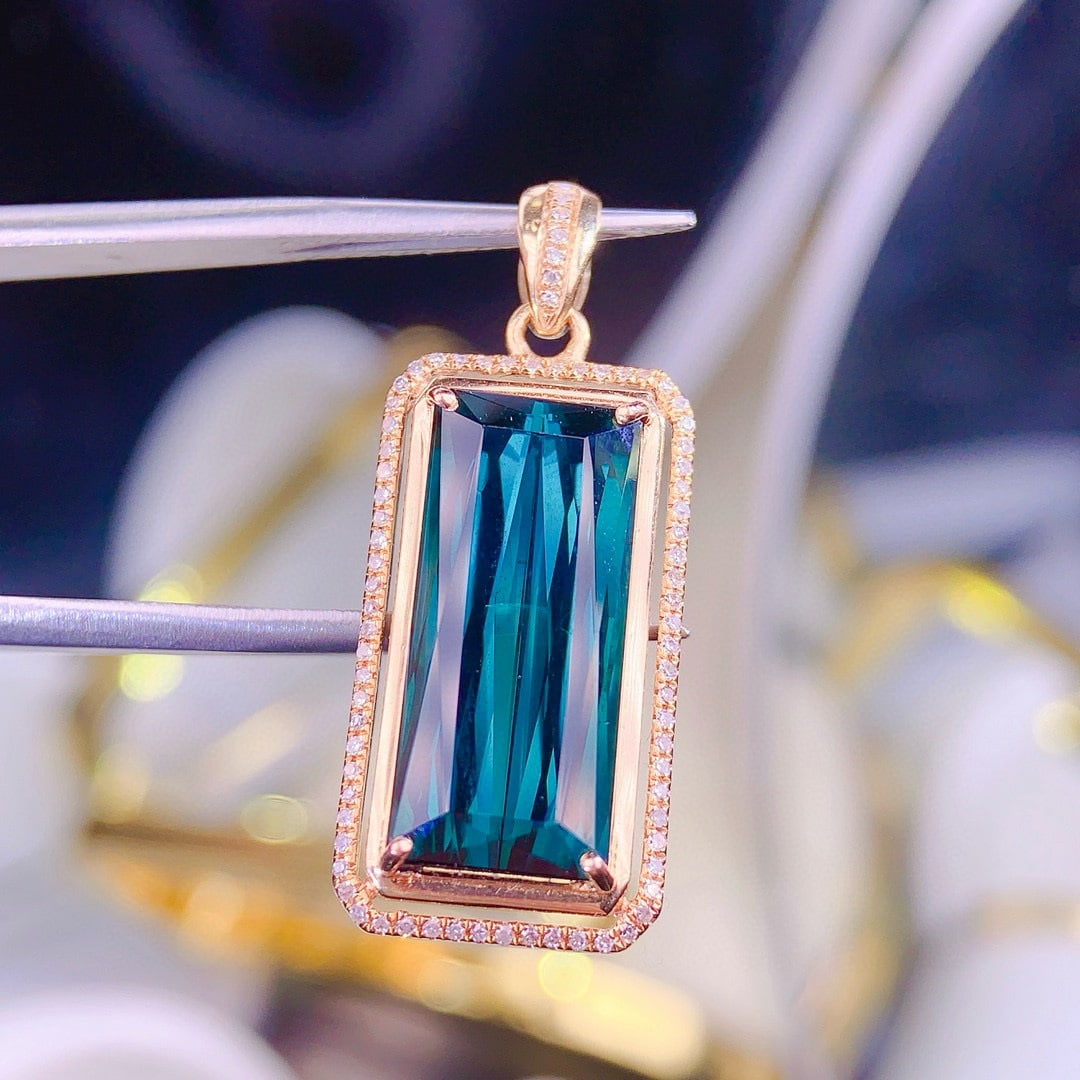 14k Gold 8.9 Ct Natural Tourmaline & Diamond Pendant( Without Chain ): Ref:230950327 // gold content:14k gold // main gemstone:tourmaline // shape:octagonal // carat weight:8. 9ct // color:blue // treatment:natural // // adjacent gemstone 2 : diamond // shape:round //