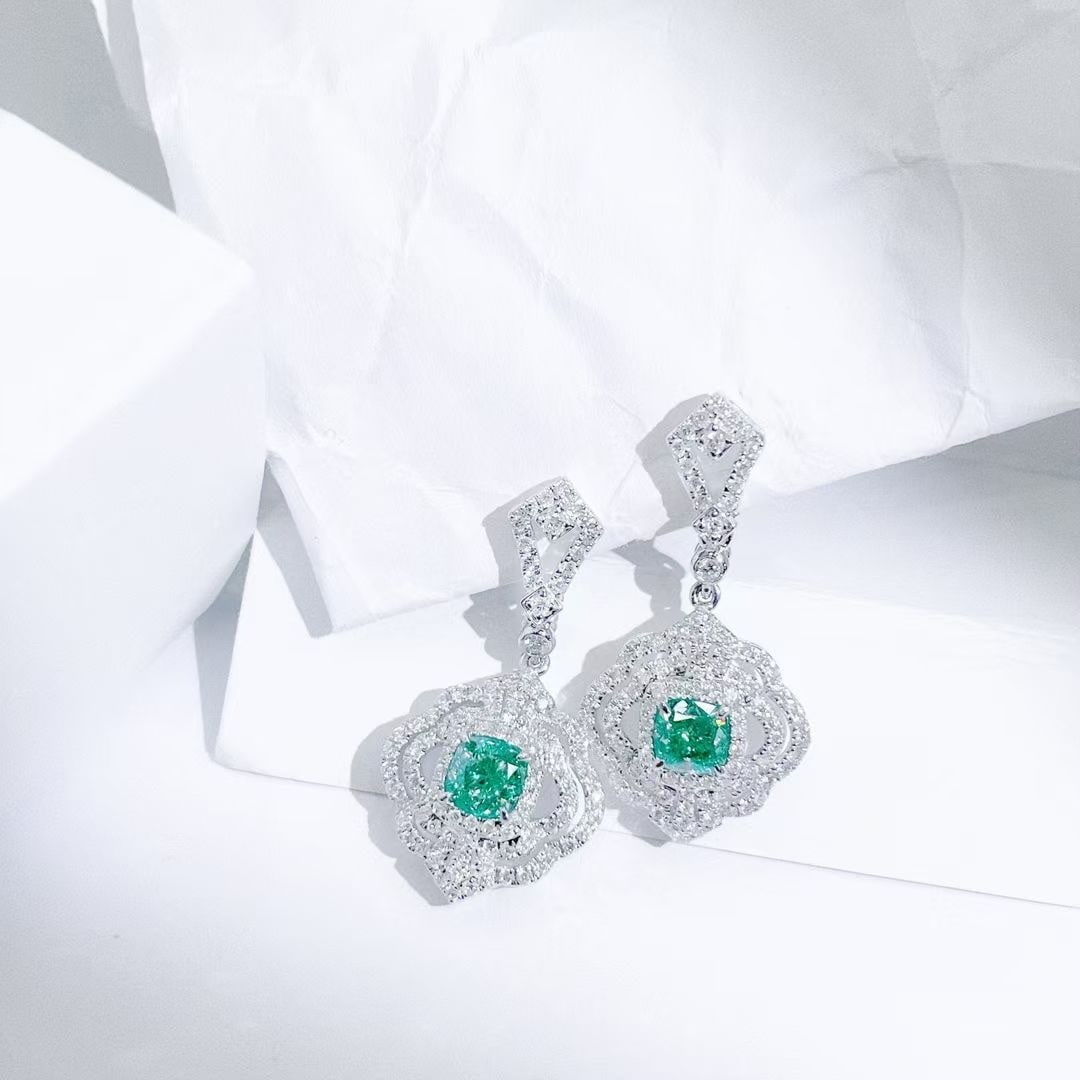14k Gold 1.89 Ctw Natural Green Diamond & Diamond Earrings: Ref:230949024 // gold content:14k gold // main gemstone:green diamond // shape:cushion // carat weight:1. 10ct // color:green // treatment:natural // // adjacent gemstone 2 : diamond // shape:round //