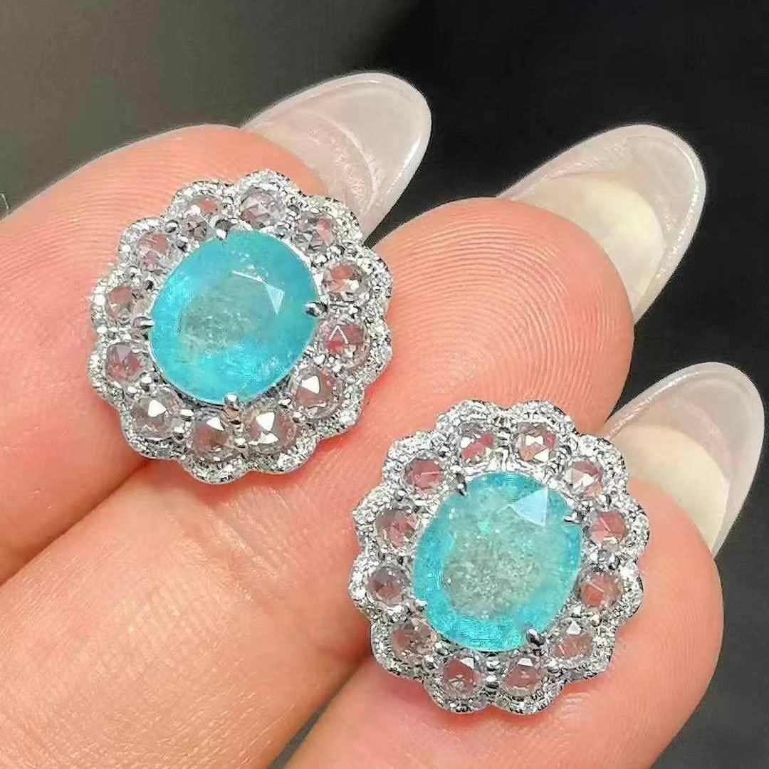 14k Gold 5.54 Ctw Natural Paraiba Tourmaline & Sapphire Earrings: Ref:230949031 // gold content:14k gold // main gemstone:paraiba tourmaline // shape:oval // carat weight:3. 78ct // color:blue // treatment:natural // // adjacent gemstone 2 : sapphire // shape:round