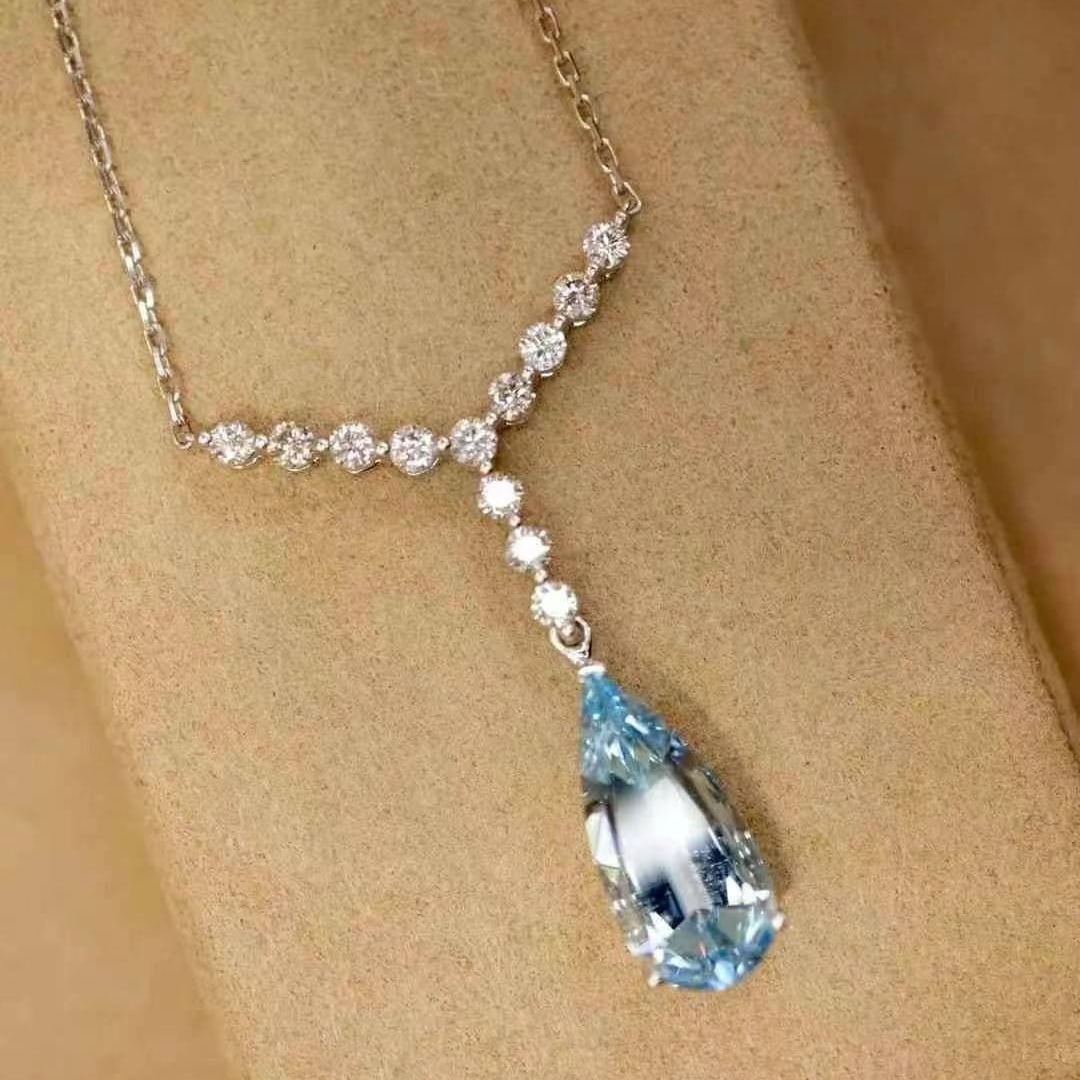 14k Gold 2.36 Ctw Natural Aquamarine & Diamond Necklace: Ref:230949036 // gold content:14k gold // main gemstone:aquamarine // shape:pear // carat weight:1. 98ct // color:santa maria color // treatment:natural // // adjacent gemstone 2 : diamond // shape:ro
