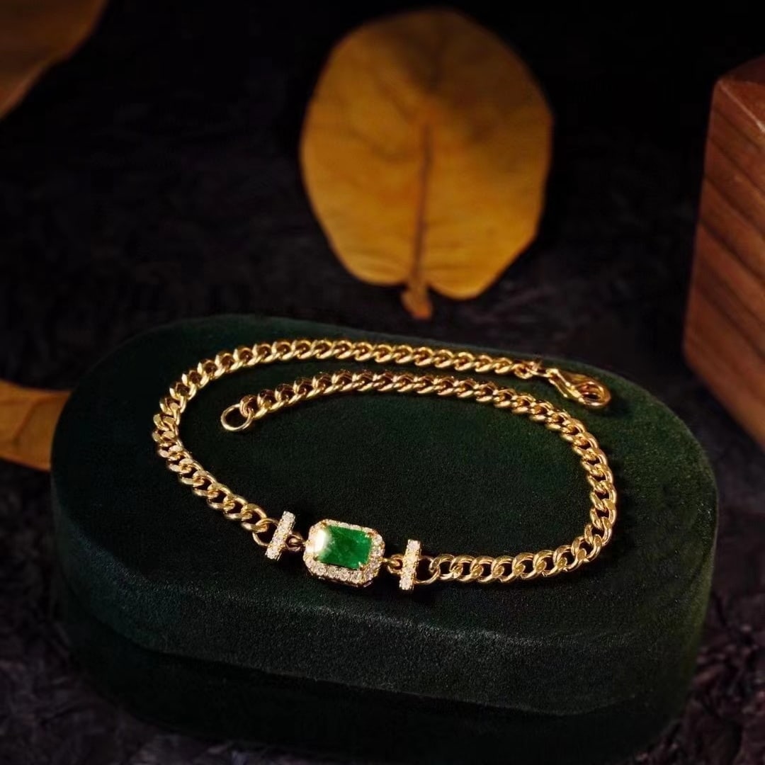 14k Gold 0.88 Ctw Vivid Green Natural Emerald & Diamond Bracelet: Ref:230949041 // gold content:14k gold // main gemstone:emerald // shape:octagonal // carat weight:0. 6ct // color:vivid green // treatment:natural // // adjacent gemstone 2 : diamond //