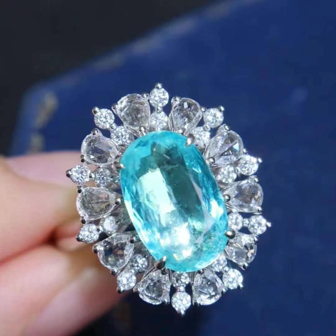 14k Gold 4.02 Ctw Natural Paraiba Tourmaline & Diamond Ring: Ref:230949067 // gold content:14k gold // ring size:7. 25us // // main gemstone:paraiba tourmaline // shape:oval // carat weight:3. 02ct // color:blue // treatment:natural // // adjacent gemstone 2 :