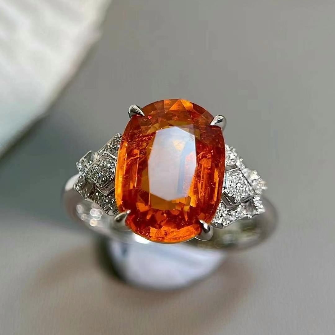 14k Gold 7.35 Ctw Natural Spessartine & Diamond Ring: Ref:230949100 // gold content:14k gold // ring size:7. 25us // // main gemstone:spessartine // shape:oval // carat weight:7. 2ct // color:orange // treatment:natural // // adjacent gemstone 2 : diamon