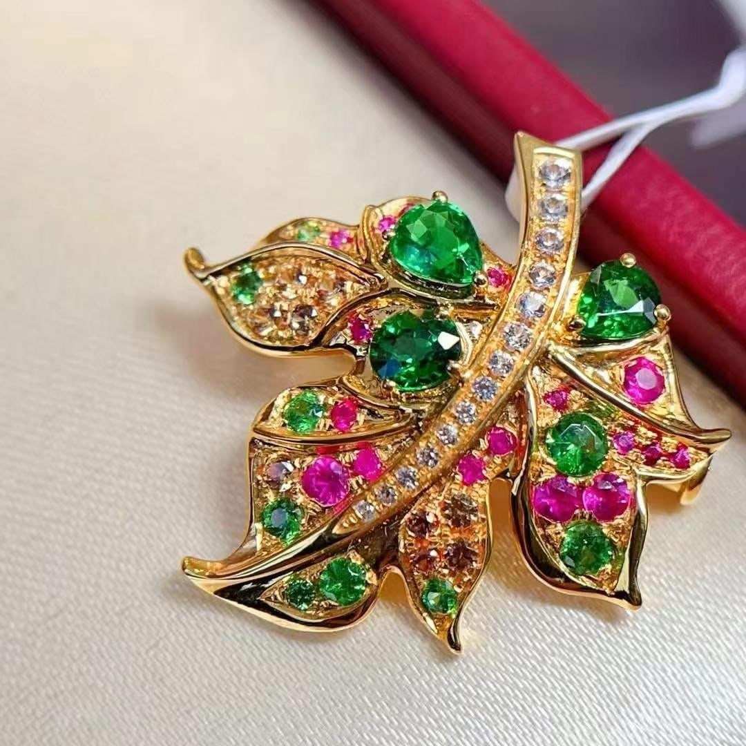 14k Gold 1.1 Ct Natural Tsavorite & Ruby & Sapphire Brooch/pendant( Without Chain ): Ref:230949117 // gold content:14k gold // main gemstone:tsavorite // shape:multiply // carat weight:1. 1ct // color:green // treatment:natural // // adjacent gemstone 2 : ruby // number of