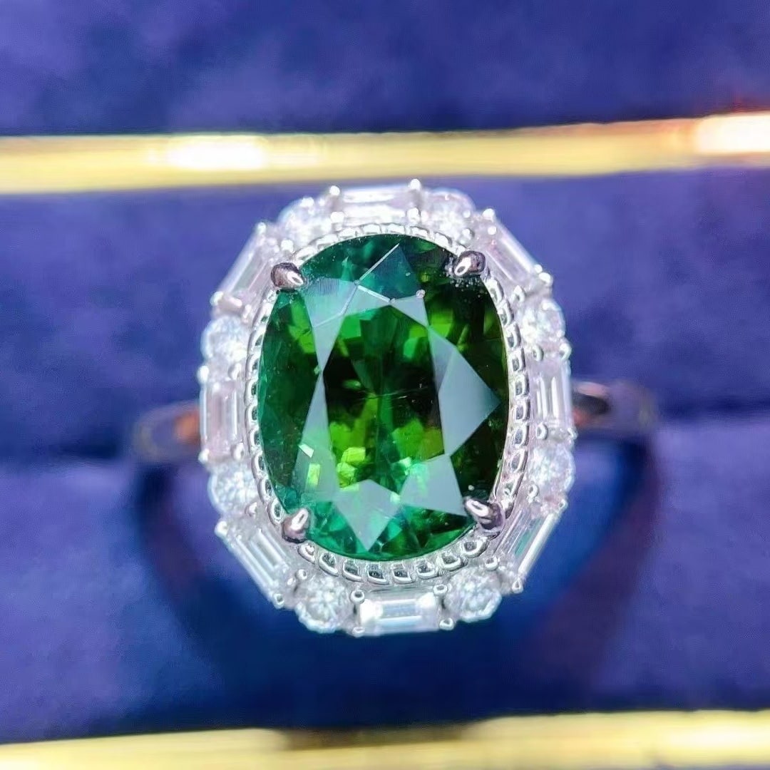 14k Gold 2.86 Ct Natural Tourmaline & Diamond Ring: Ref:230949127 // gold content:14k gold // ring size:7. 25us // // main gemstone:tourmaline // shape:oval // carat weight:2. 86ct // color:green // treatment:natural // // adjacent gemstone 2 : diamond
